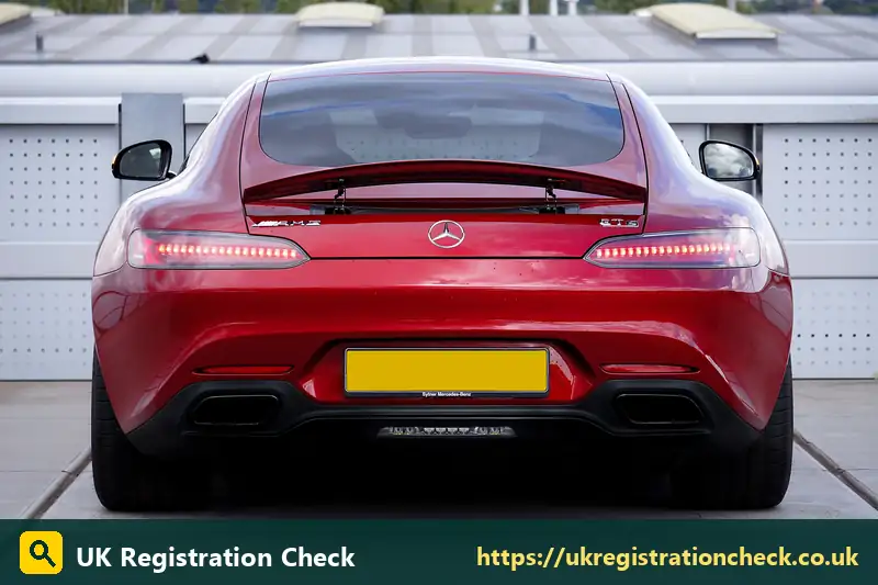 Rear of a red sports car with a yellow number plate - display registration plates