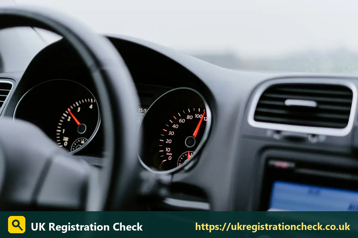 Car dashboard showing the speedometer and odometer - mileage check